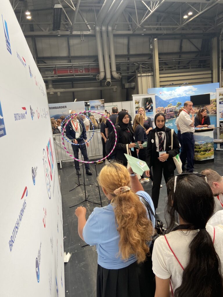 girl throwing paper plane