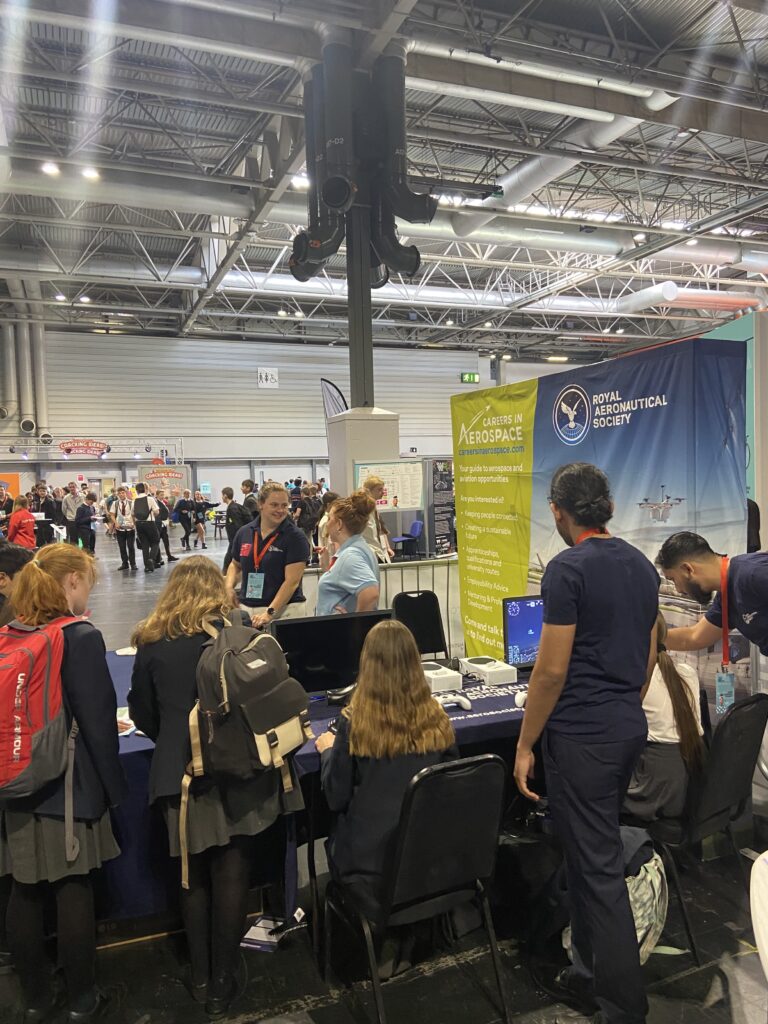 The backs of multiple girls heads as they take part in activities at the Big Bang Fair